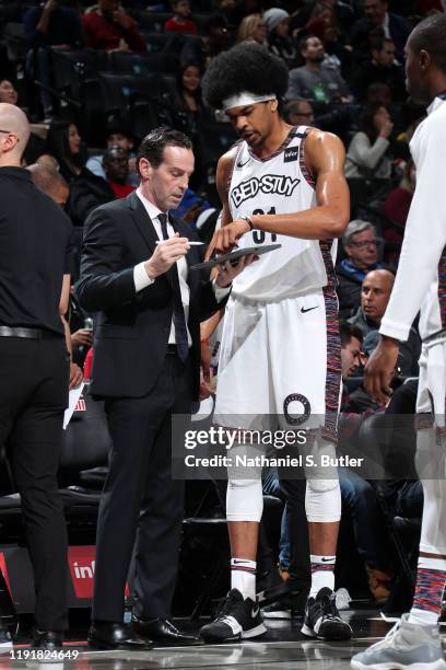 Jarrett Allen of the Brooklyn Nets looks over a play with Head Coach, Kenny Atkinson during the game against the Toronto Raptors on January 4, 2020...