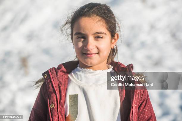 cute girl looking at camera outdoors smiling - lebanese ethnicity stock pictures, royalty-free photos & images