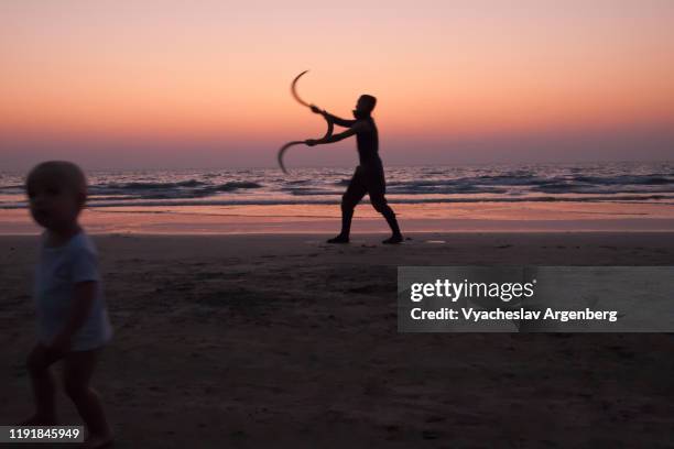 arambol live art performance late at night, goa - goa nightlife stock pictures, royalty-free photos & images