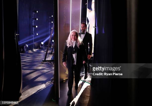 Jackie Weaver and Alex Dimitriades walk backstage during the 2019 AACTA Awards Presented by Foxtel at The Star on December 04, 2019 in Sydney,...