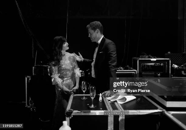 Essie Davis and Dr. Chris Brown talk backstage during the 2019 AACTA Awards Presented by Foxtel at The Star on December 04, 2019 in Sydney, Australia.