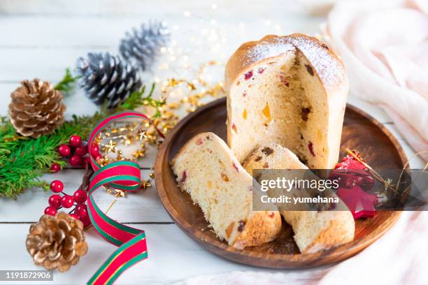 panettone traditional italian christmas cake on wooden white table - panettone stock pictures, royalty-free photos & images
