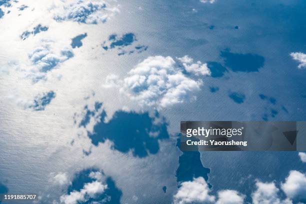 group of white cloud flying over the sea,bird view - aerial cloudscape stock pictures, royalty-free photos & images