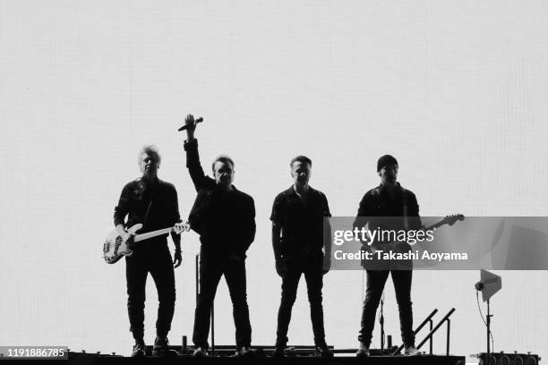 Adam Clayton, Bono, Larry Mullen Jr. And The Edge of U2 perform at Saitama Super Arena on December 04, 2019 in Saitama, Japan.