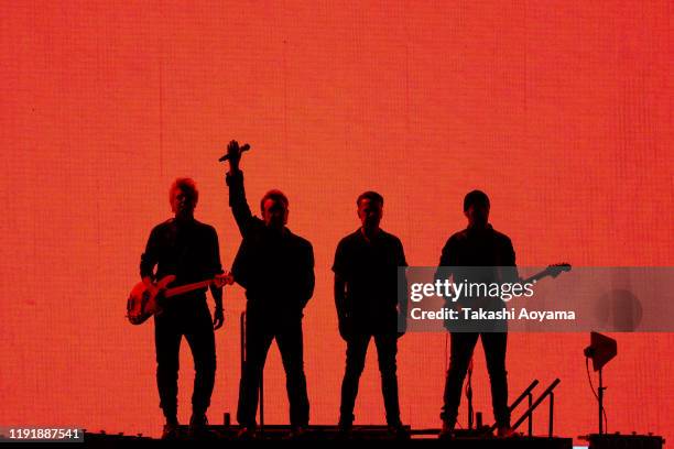 Adam Clayton, Bono, Larry Mullen Jr. And The Edge of U2 perform at Saitama Super Arena on December 04, 2019 in Saitama, Japan.