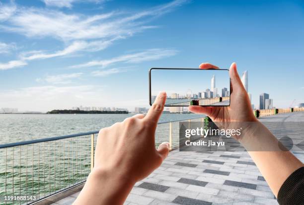 take a picture of suzhou jinji lake with smart phone - photo messaging stock pictures, royalty-free photos & images