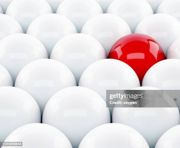 one red sphere amidst white another. different unique leadership sphere success business. 3d render - red sphere stock pictures, royalty-free photos & images