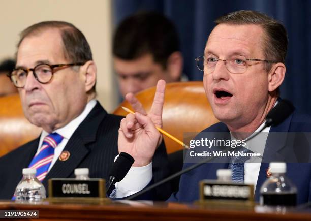 Committee ranking member Rep. Doug Collins delivers his opening statement as committee chairman Rep. Jerry Nadler listens during an impeachment...