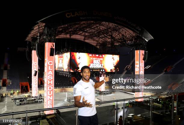 Anthony Joshua poses for a photo inside the Diriyah Arena during the Clash On The Dunes Press Conference at the Diriyah Arena on December 04, 2019 in...