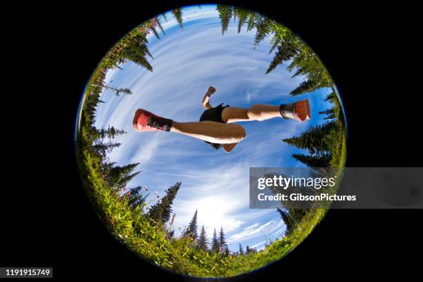 trail running jump - fish eye lens people stock pictures, royalty-free photos & images