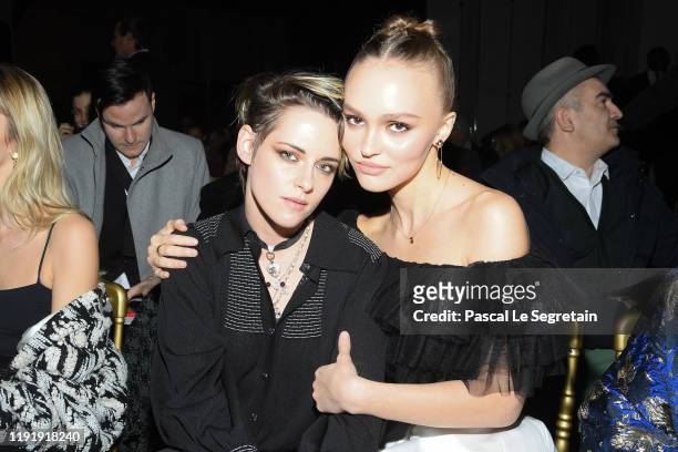 Kristen Stewart and Lily-Rose Depp attend the Chanel Metiers d'art 2019-2020 show at Le Grand Palais on December 04, 2019 in Paris, France.
