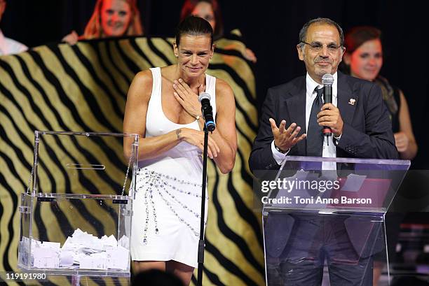 Princess Stephanie of Monaco and host Marc Toesca during the Tombola Drawing at the FightAids Monaco Summer Gala at the Monte Carlo Sporting Club on...