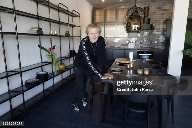 Renzo Rosso poses in the dining room at the DIESEL Wynwood 28 Press Preview on December 04, 2019 in Miami, Florida.