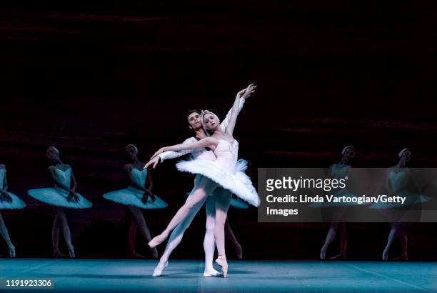 Russian ballet dancers Anna Nikulina and Artem Ovcharenko perform, with the company, in the Bolshoi Ballet production of 'Swan Lake' during the...