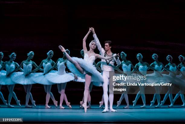 Russian ballet dancers Anna Nikulina and Artem Ovcharenko perform, with the company, in the Bolshoi Ballet production of 'Swan Lake' during the...