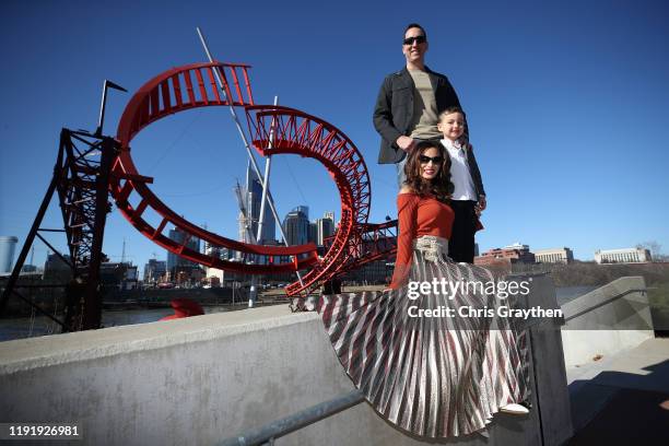 Monster Energy NASCAR Cup Series Champion Kyle Busch, along with his wife Samantha and son Brexton pose for a photo with the Championship Trophy on...