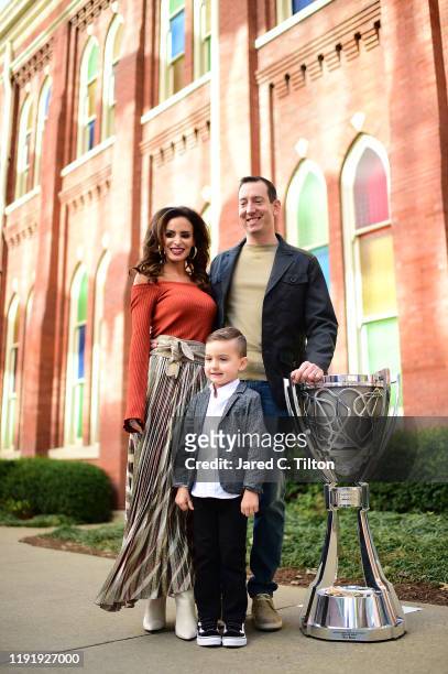 Monster Energy NASCAR Cup Series Champion Kyle Busch, along with his wife Samantha and son Brexton pose for a photo with the Championship Trophy on...