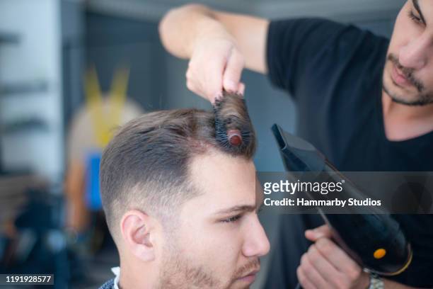 Hairdresser Blow Drying Young Mans Hair In Barber Shop High-Res Stock Photo  - Getty Images