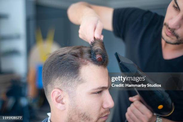 Hairdresser Blow Drying Young Mans Hair In Barber Shop High-Res Stock Photo - Getty Images Hairdresser Blow Drying Young Mans Hair In Barber Shop High-Res Stock Photo - Getty Images