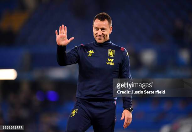 John Terry, Assistant Head Coach of Aston Villa acknowledges the fans during the warm up prior to the Premier League match between Chelsea FC and...