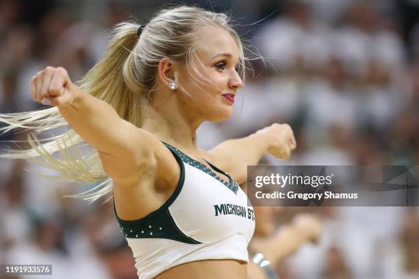 Michigan State Spartans cheerleaders perform during a game against the Duke Blue Devils at the Breslin Center on December 03, 2019 in East Lansing,...