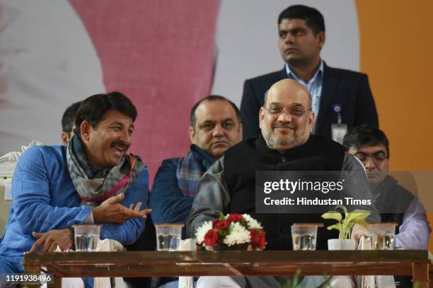 Home Minister Amit Shah and Delhi BJP president Manoj Tiwari during Bharatiya Janata Party's booth-level workers rally at Indira Gandhi Indoor...