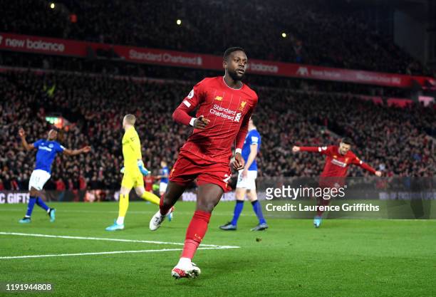 Divock Origi of Liverpool celebrates after scoring his team's first goal during the Premier League match between Liverpool FC and Everton FC at...