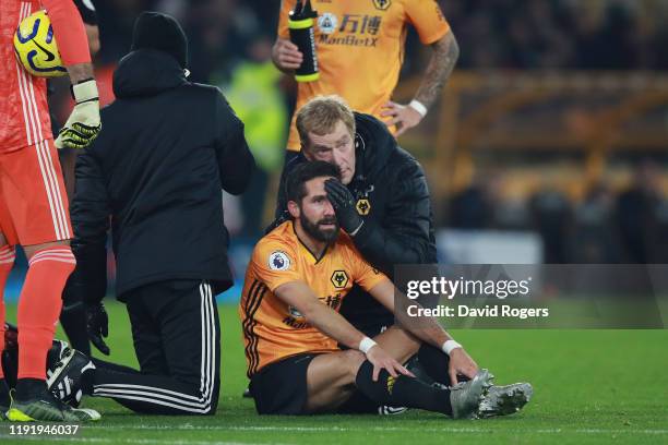 Joao Moutinho of Wolverhampton Wanderers receives medical treatment during the Premier League match between Wolverhampton Wanderers and West Ham...