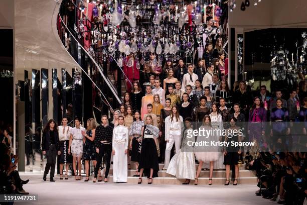 Virginie Viard acknowledges the audience during the finale of the Chanel Metiers d'Art 2019-2020 show with models at Le Grand Palais on December 04,...