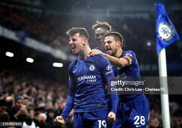 Mason Mount of Chelsea celebrates with teammates Cesar Azpilicueta and Tammy Abraham after scoring his team's second goal during the Premier League...