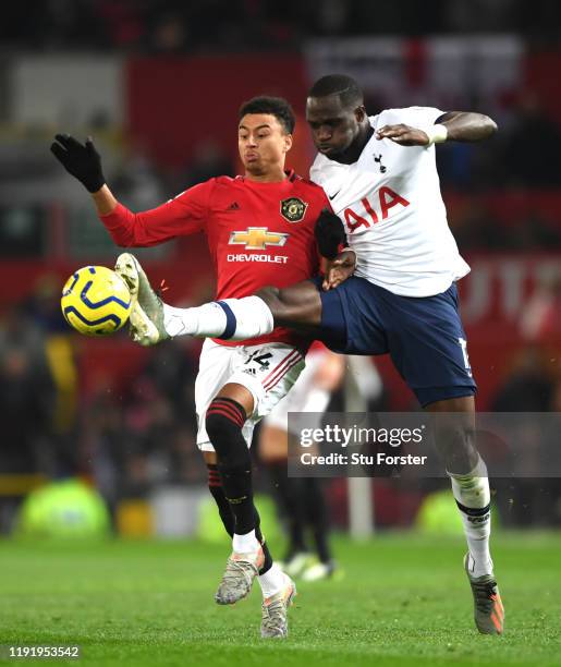 Moussa Sissoko of Tottenham Hotspur battles for possession with Jesse Lingard of Manchester United during the Premier League match between Manchester...