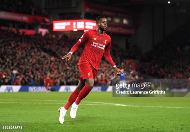 Divock Origi of Liverpool celebrates after scoring his team's third goal during the Premier League match between Liverpool FC and Everton FC at...