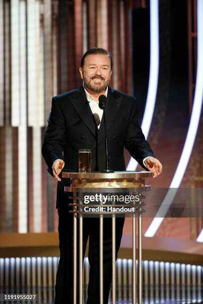 In this handout photo provided by NBCUniversal Media, LLC, host Ricky Gervais speaks onstage during the 77th Annual Golden Globe Awards at The...