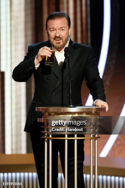 In this handout photo provided by NBCUniversal Media, LLC, host Ricky Gervais speaks onstage during the 77th Annual Golden Globe Awards at The...