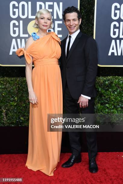 Actress Michelle Williams and Thomas Kail arrive for the 77th annual Golden Globe Awards on January 5 at The Beverly Hilton hotel in Beverly Hills,...
