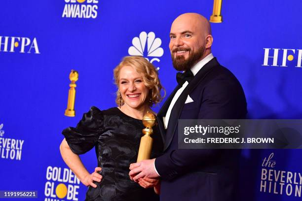 Director Chris Butler and producer Arianne Sutner pose in the press room with the award for Best Motion Picture - Animated for "Missing Link" during...