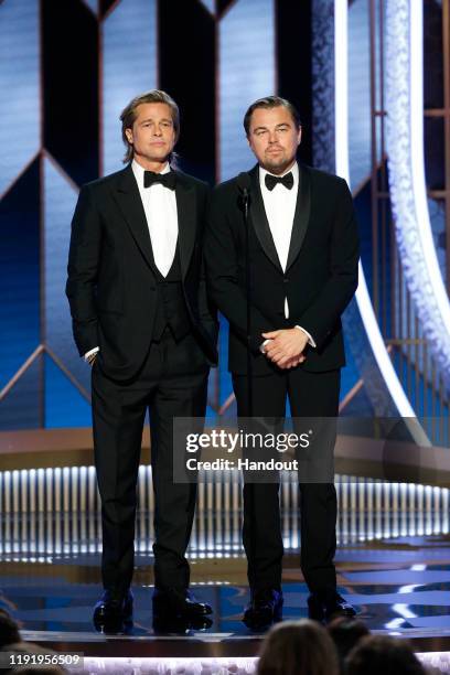 In this handout photo provided by NBCUniversal Media, LLC, Brad Pitt and Leonardo DiCaprio speak onstage during the 77th Annual Golden Globe Awards...