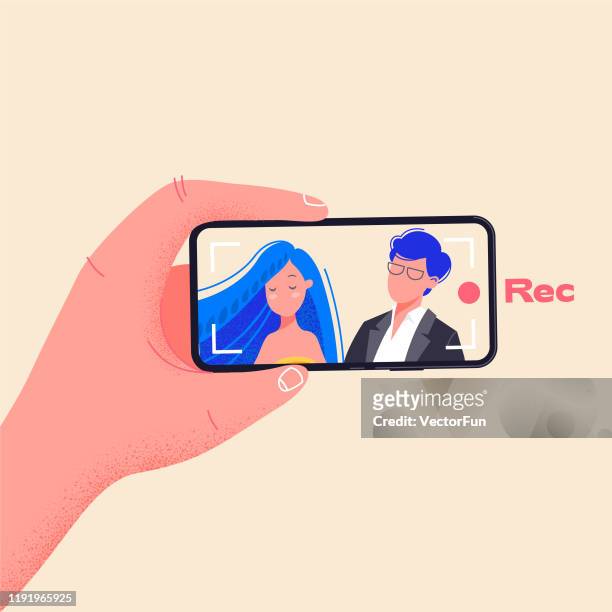 Man hold phone horizontally and record video. Make video by pressing red record button. Young couple on smartphone screen vector illustration. Flat design drawing about phone addiction.