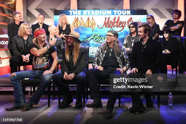 Rick Allen, Joe Elliott, Vivian Campbell, Phil Collen, and Rick Savage of Def Leppard, Nikki Sixx, Vince Neil, Mick Mars, and Tommy Lee of Mötley...