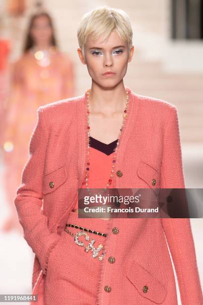 Model walks the runway during the Chanel Metiers d'art 2019-2020 show at Le Grand Palais on December 04, 2019 in Paris, France.