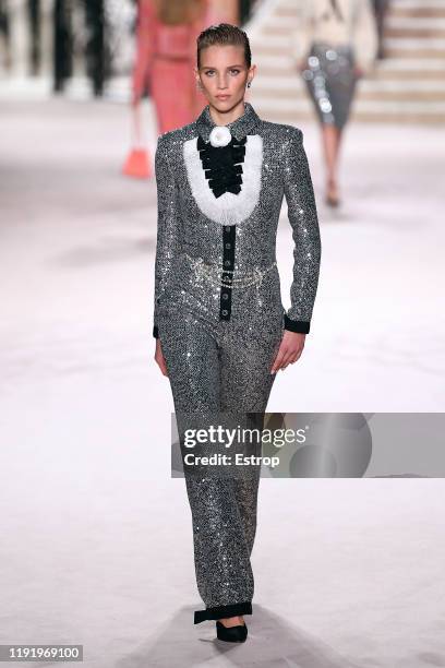 Model walks the runway during the Chanel Metiers d'art 2019-2020 show at Le Grand Palais on December 4, 2019 in Paris, France.