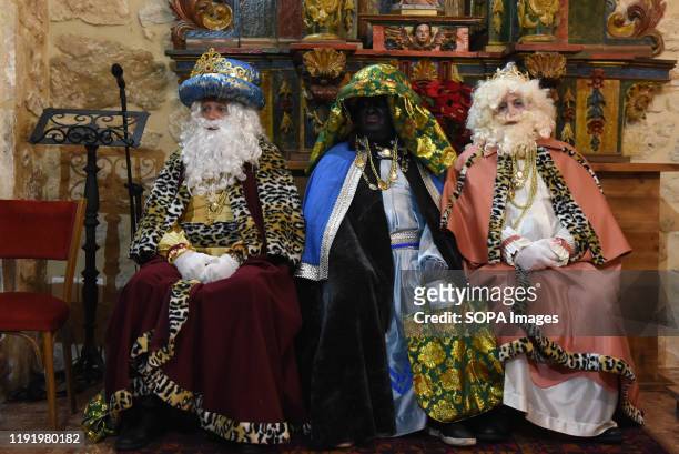 Performers dressed as Baltasar King, Gaspar King and Melchoir King are seen inside a church after the Cabalgata de Reyes or the Three Kings parade at...