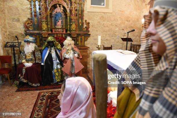 Performers dressed as Baltasar King, Gaspar King and Melchoir King are seen inside a church during the Cabalgata de Reyes or the Three Kings parade...