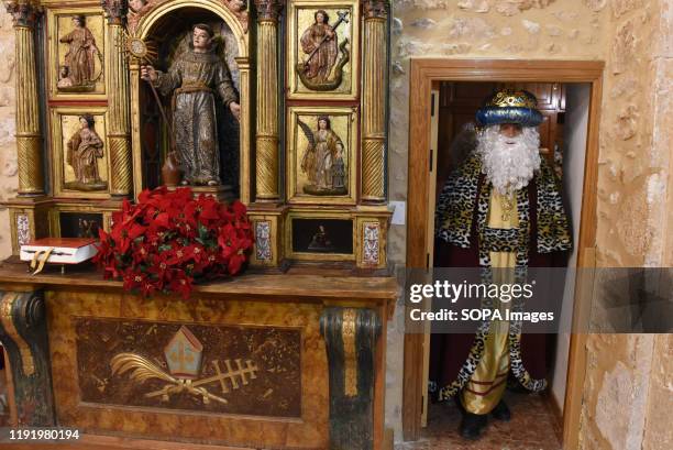 Performer dressed as Gaspar King is seen inside a church after the Cabalgata de Reyes or the Three Kings parade at the Spanish village of Rebollo de...