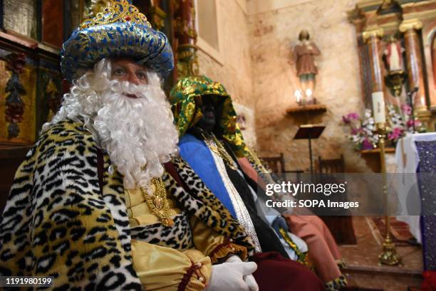 Performer dressed as Gaspar King is seen inside a church during the Cabalgata de Reyes or the Three Kings parade at the Spanish village of Rebollo de...