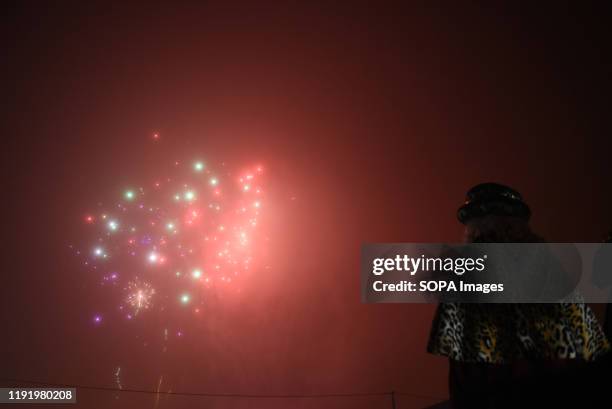 Villagers dressed as Gaspar King watch fireworks during the Cabalgata de Reyes or the Three Kings parade at the Spanish village of Rebollo de Duero....