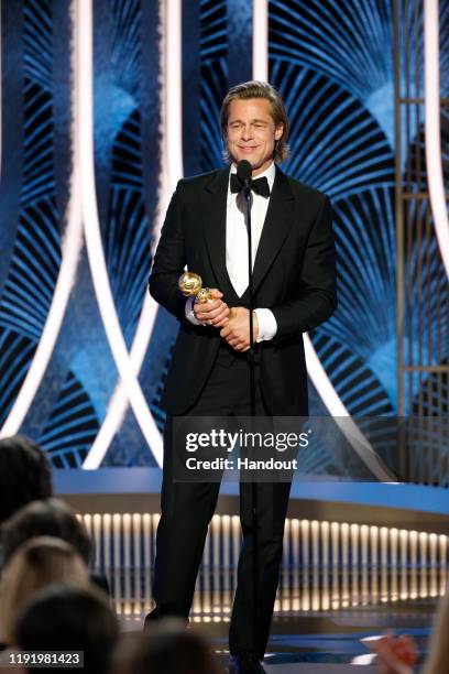 In this handout photo provided by NBCUniversal Media, LLC, Brad Pitt accepts the award for BEST PERFORMANCE BY AN ACTOR IN A SUPPORTING ROLE IN ANY...