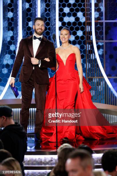 In this handout photo provided by NBCUniversal Media, LLC, Chris Evans and Scarlett Johansson onstage during the 77th Annual Golden Globe Awards at...