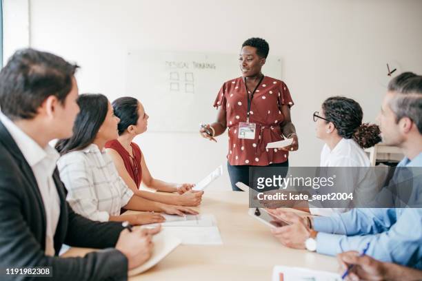 meeting in a boardroom - sports training stock pictures, royalty-free photos & images