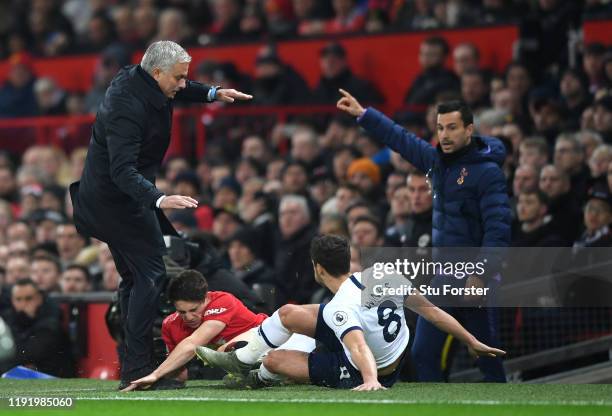 Daniel James of Manchester United collides into Jose Mourinho, Manager of Tottenham Hotspur as he is tackled by Harry Winks of Tottenham Hotspur...